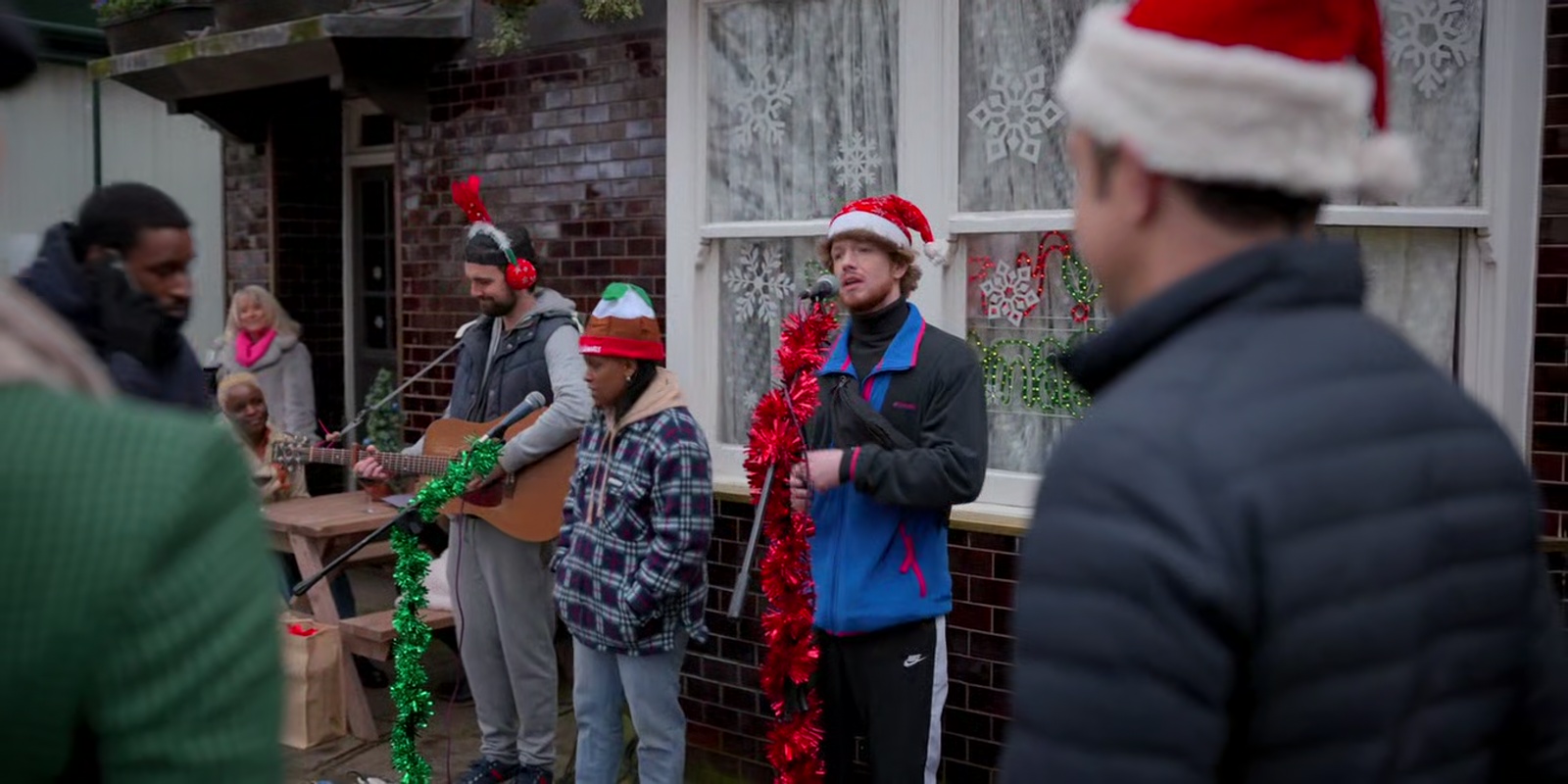 Buskers singing: Last Christmas I gave you my heart But the very next day you gave it away...